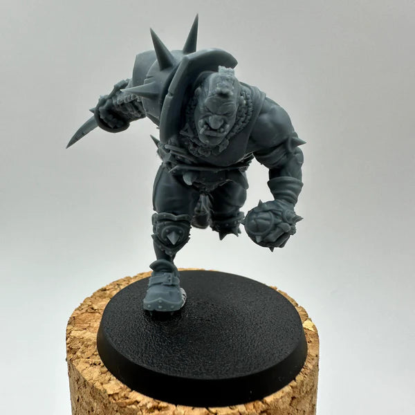 Dynamic fantasy berserker miniature with spiked gauntlet, shoulder armor and dagger, posed mid-charge — unpainted 3D-printed resin figure for tabletop and painting, Proxy Wargaming Australia.