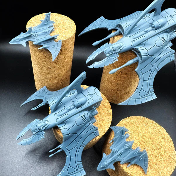 Multiple futuristic alien jet fighter miniatures with organic curved wing shapes, spiked nose and dual cannon pylons — unpainted high-detail resin prints for tabletop wargaming, Proxy Wargaming Australia.