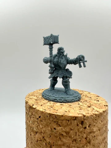 Detailed fantasy dwarf hero miniature with hammer, beard braids, armored boots and key symbols, unpainted resin print for tabletop RPGs and wargaming — Proxy Wargaming Australia.