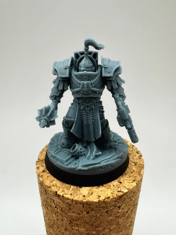 Detailed futuristic armoured warrior with crested helmet, chain tabard, gauntlet weapon and pistol, standing on scenic base — unpainted resin miniature for tabletop wargaming by Proxy Wargaming Australia.